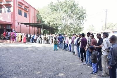 Bikaner: Voters wait in a queue at a polling station to cast their votes for Rajasthan Assembly elections, in Bikaner on Dec 7, 2018. (Photo: IANS)