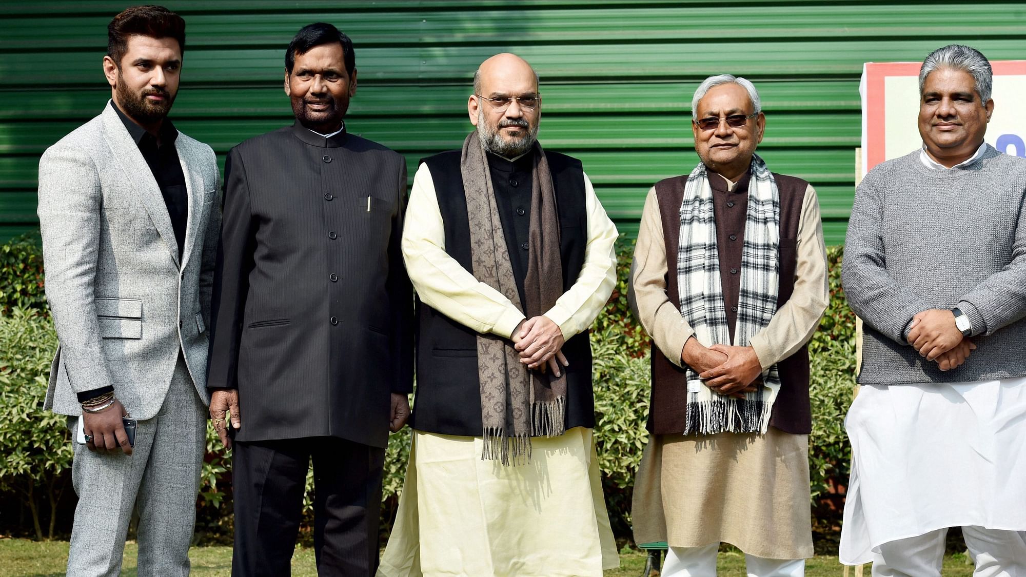 BJP President Amit Shah flanked by JD(U) Chief and Bihar CM Nitish Kumar, LJP President Ram Vilas Paswan, his son Chirag Paswan and BJP leader Bhupendra Yadav on 23 December.