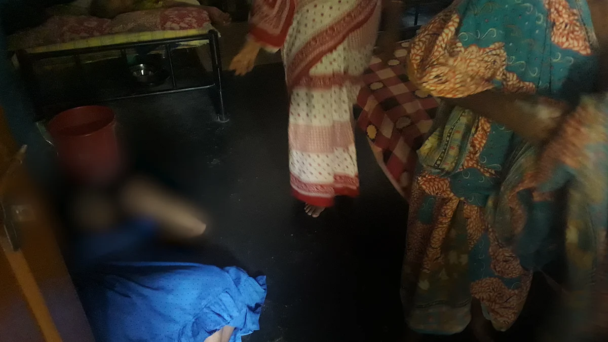A mentally challenged woman on the floor in a shelter home in Odisha.