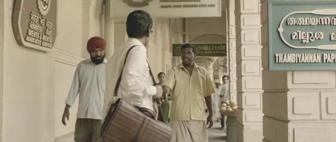 A South Indian berates a young Bal Thackeray for bumping into him. A still from the trailer of <i>Thackeray. </i>