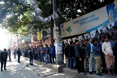 DHAKA, Dec. 30, 2018 (Xinhua) -- Voters line up at a polling station in Dhaka, Bangladesh, Dec. 30, 2018. Nationwide voting opened Sunday morning in Bangladesh