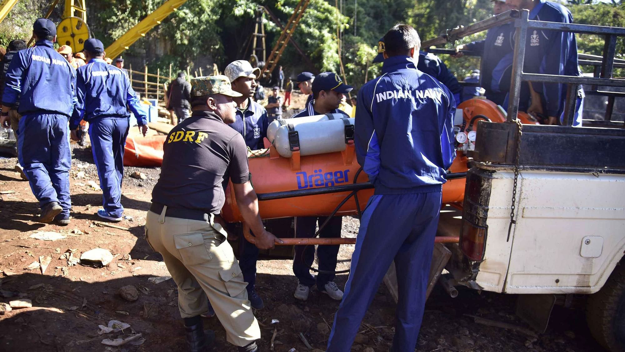 A team of 11 Navy divers with their equipments deployed to conduct rescue task at the site of a coal mine collapse at Ksan, in Jaintia Hills district of Meghalaya, Sunday, 30 December.