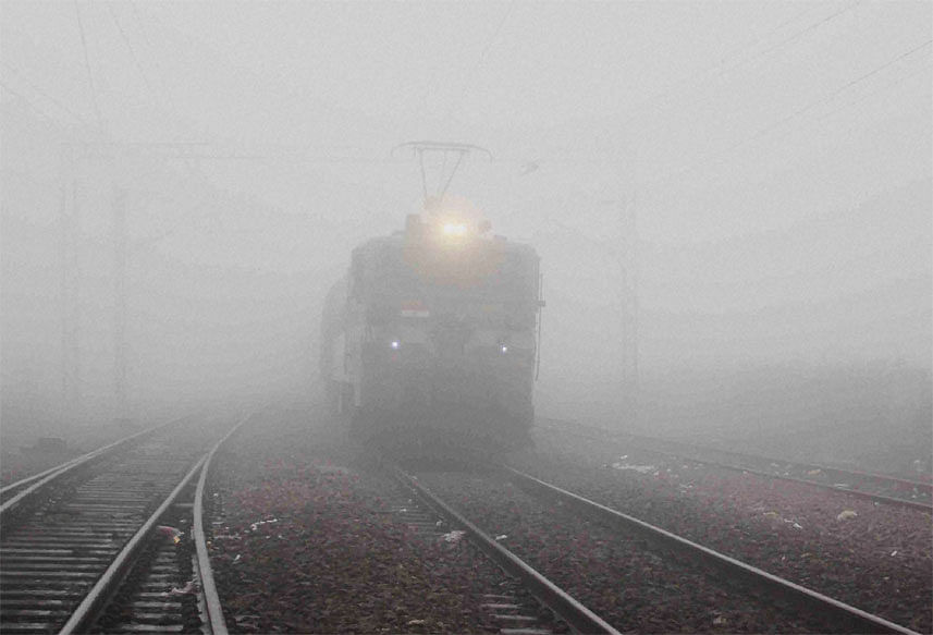 Severe cold wave and dense smog grip the National Capital Region. Several flights and trains delayed or rescheduled.