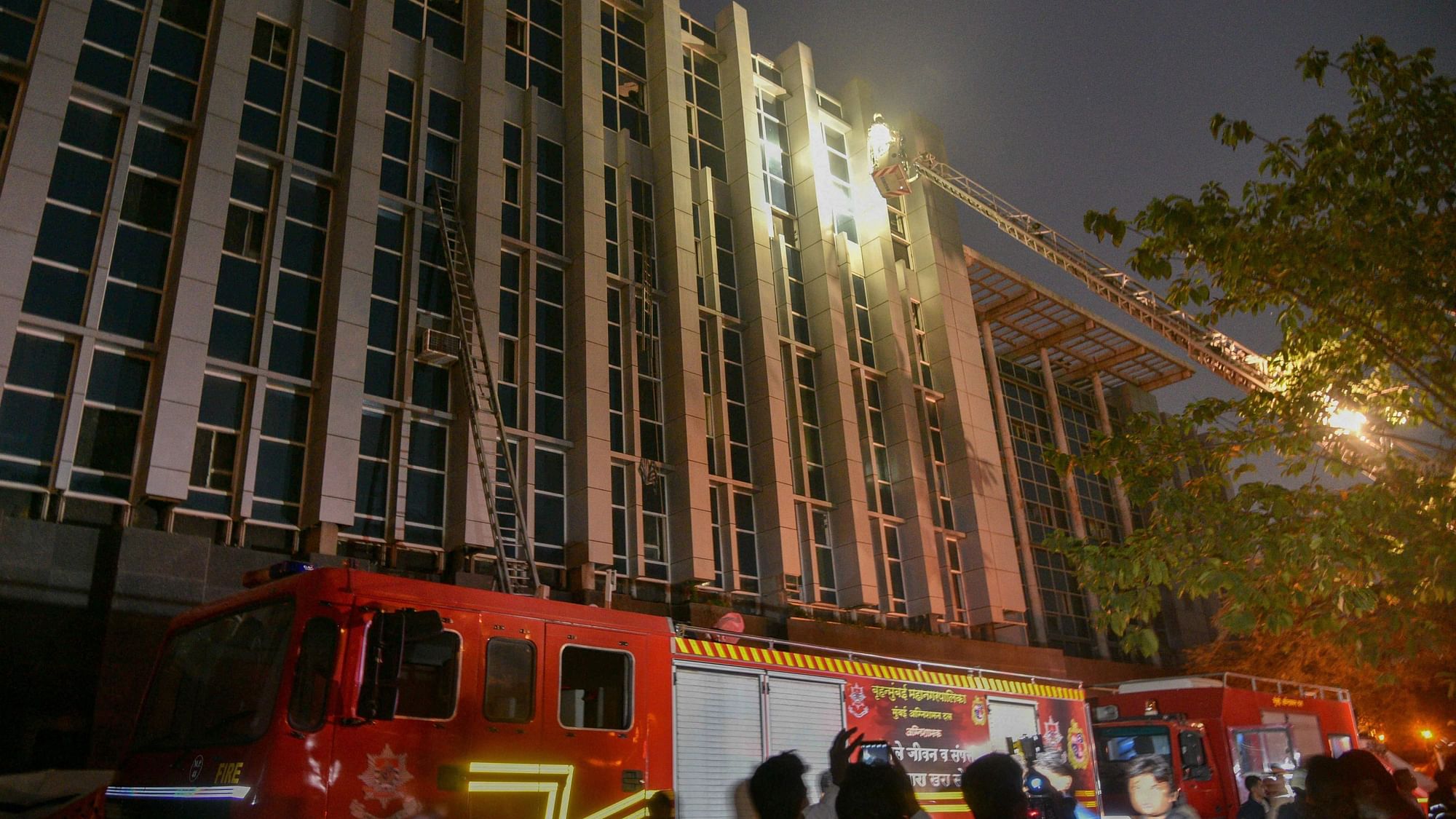 Firefighters conduct rescue after a major fire broke out at ESIC Kamgar Hospital, in Mumbai on Monday, 17 December.