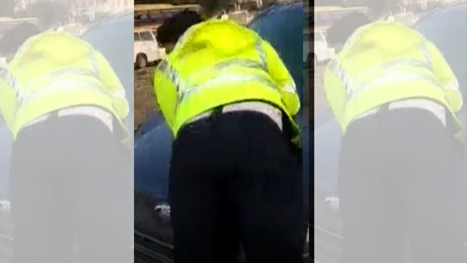 A man dragged a traffic police officer on his car bonnet after being stopped for driving on the wrong side.