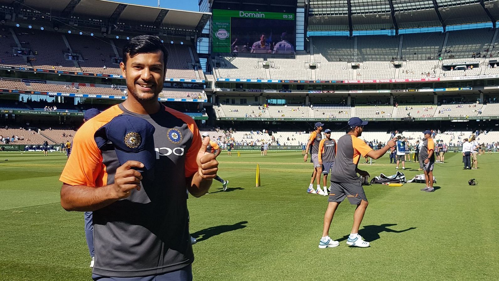 Mayank Agarwal holds up his India cap before making his international debut at the Boxing Day Test against Australia.