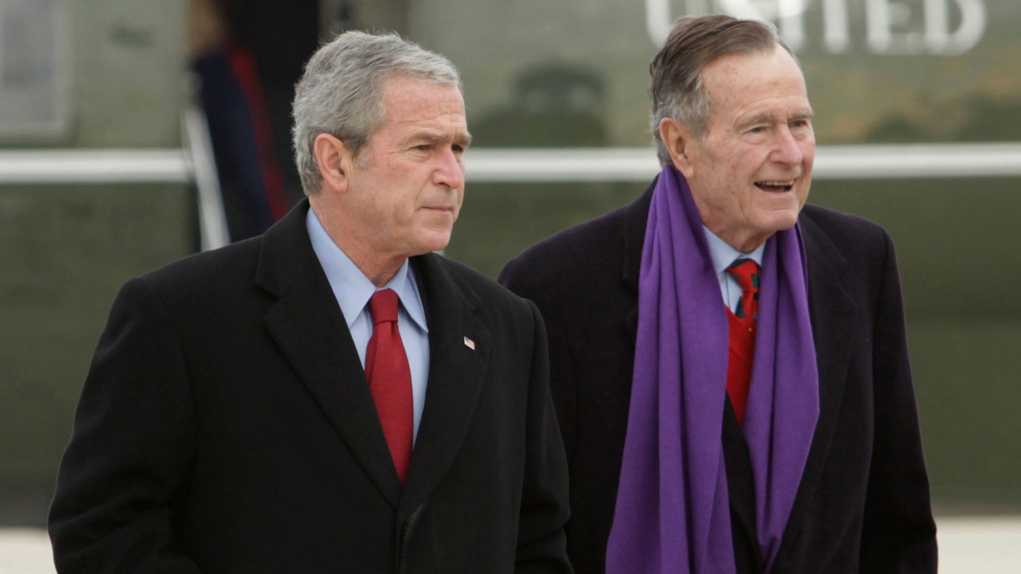 File photo of former US President George W Bush (L) walking with his father, another former US President George HW Bush.