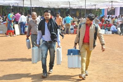 Polling officials carrying the Electronic Voting Machines (EVMs) and other necessary inputs required for the second and final phase of the Chhattisgarh Assembly polls. (Photo: IANS)