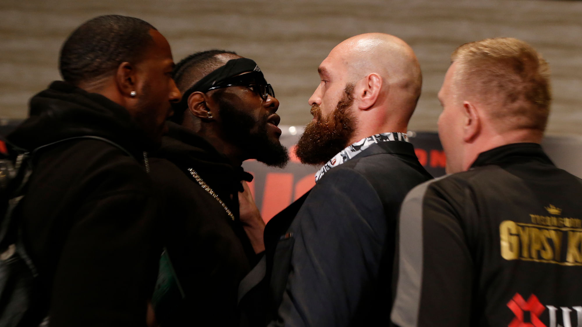 Boxers Deontay Wilder, second from left, and Tyson Fury, center, exchange words as they face each other at a news conference in Los Angeles, Wednesday, Nov. 28, 2018. The pair are slated to fight Saturday night for Wilder’s WBC heavyweight title.&nbsp;