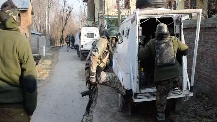 Security forces at the site of the Pulwama encounter.
