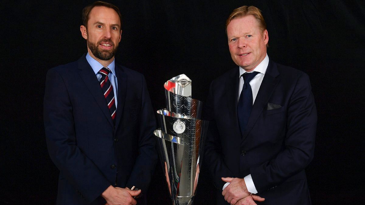England manager Gareth Southgate (L) and Netherlands coach Ronald Koeman pose with the UEFA Nations League trophy.