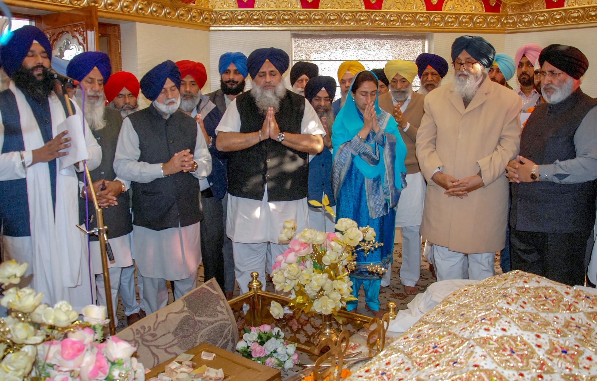 Former chief minister of Punjab Parkash Singh Badal, Shiromani Akali Dal President Sukhbir Singh Badal and Union minister Harsimrat Kaur Badal with other SAD leaders offer prayers in front of the Guru Granth Sahib, at the Golden Temple in Amritsar, Saturday, Dec. 8, 2018.