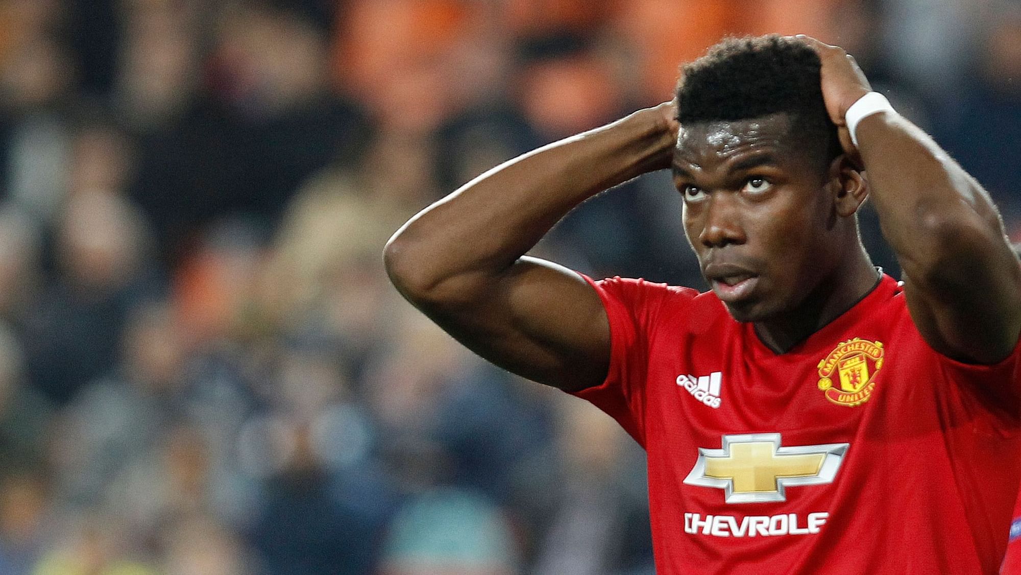 Manchester United’s Paul Pogba reacts after missing a chance to score during a Group H Champions League soccer match.