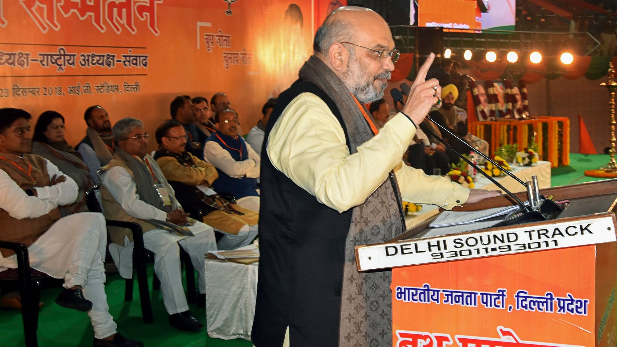 BJP President Amit Shah addresses a booth-level workers meeting in New Delhi on 23 December.
