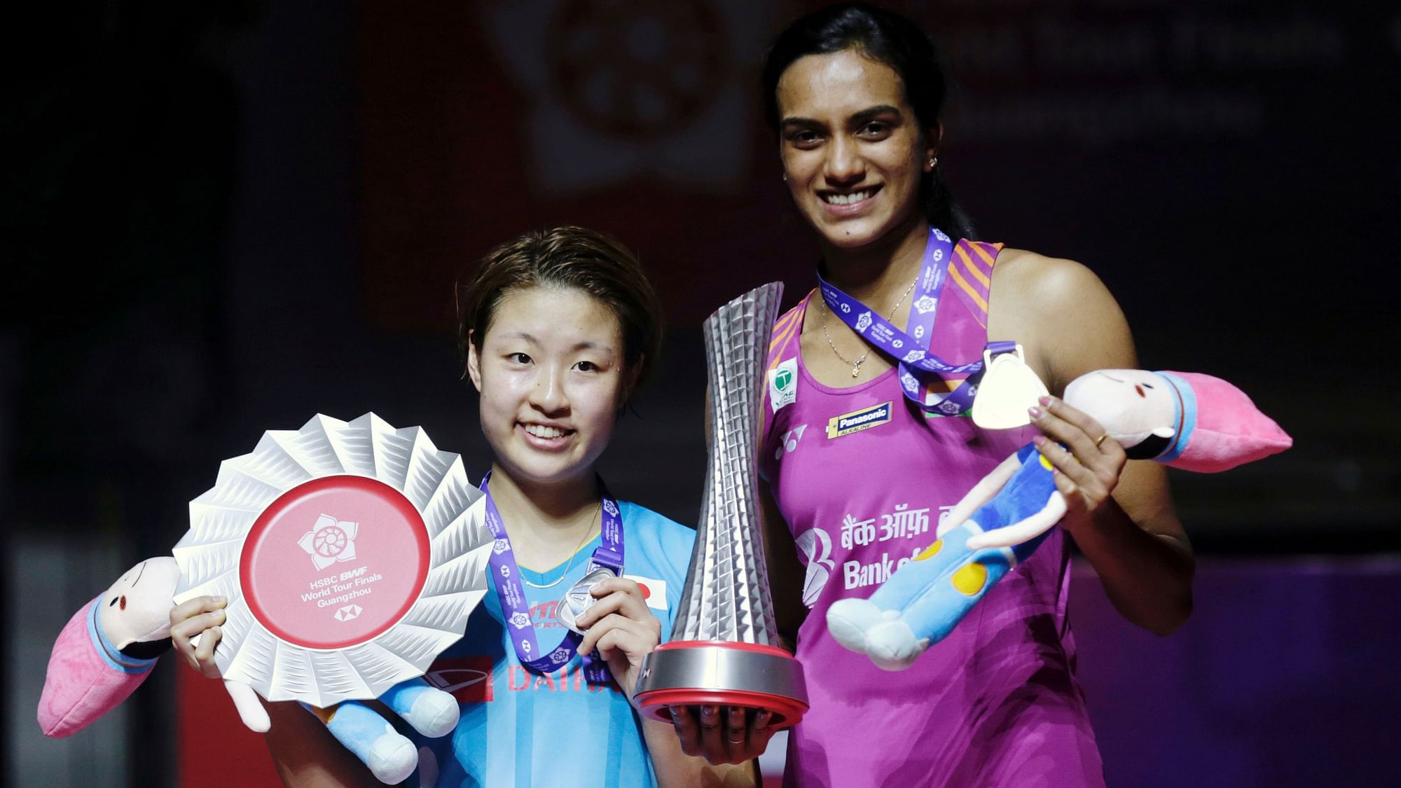 PV Sindhu and Nozomi Okuhara (left) at the trophy presentation after the BWF World Tour Finals at Guangzhou, China.