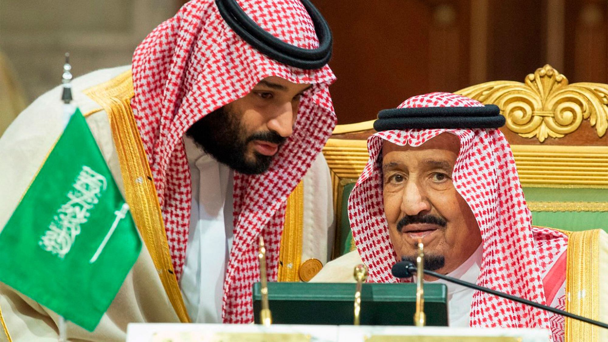 Saudi Crown Prince Mohammed bin Salman (left) speaks to his father, King Salman,  at a meeting of the Gulf Cooperation Council.