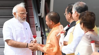  Uttar Pradesh Chief Minister Yogi Adityanath receives Prime Minister Narendra Modi on his arrival in Lucknow, Uttar Pradesh on 28 June 2018.&nbsp;
