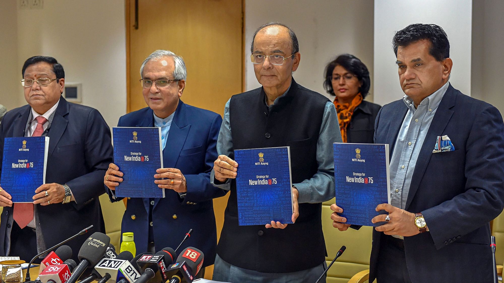 Union Minister for Finance and Corporate Affairs Arun Jaitley flanked by NITI Aayog Vice Chairman Rajiv Kumar and CEO Amitabh Kant (R) with member VK Saraswat (L) release NITI Aayog’s Strategy Document for New India@75.