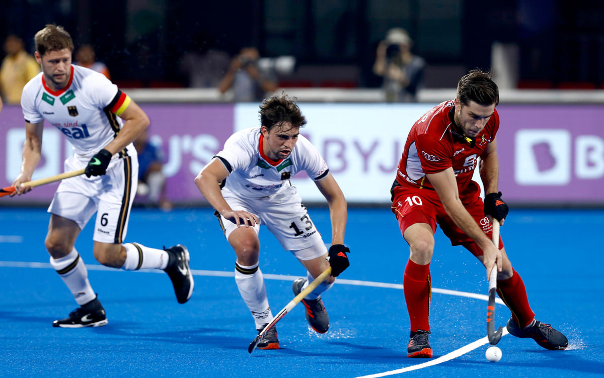 Olympic silver medallist Belgium defeated two-time champions Germany 2-1 in the  quarters of the hockey World Cup.