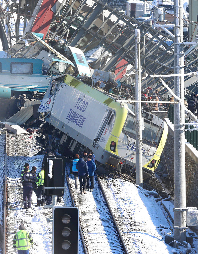 At least two cars derailed, hitting the station’s overpass, which then collapsed onto the train.