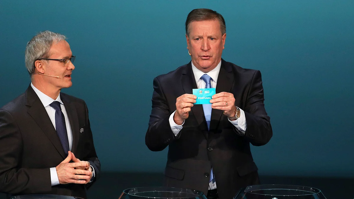 UEFA Deputy General Secretary Giorgio Marchetti (left) gestures as former Irish footballer Ronnie Whelan draws Portugal during the UEFA Euro 2020 qualifying draw at the Convention Centre in Dublin in Ireland on Sunday, December 2, 2018.