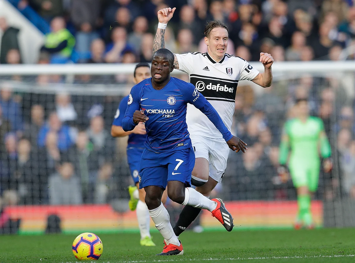 Chelsea’s N’Golo Kante, left, challenges for the ball with Fulham’s Stefan Johansen during the English Premier League soccer match between Chelsea and Fulham.