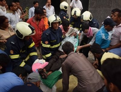 Mumbai: Rescue operations underway at the Employees State Insurance Corporation (ESIC) Hospital where a fire broke out killing six persons on in Mumbai, Dec 17, 2018. The number of fatalities is likely to increase further as several injured persons have been admitted to various hospitals in serious condition even as the firemen battled the conflagration to bring it under control after three hours. The fire, caused by a suspected short-circuit, was first noticed in the upper floors of the five-st