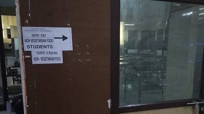 Pictures posted with the Facebook post show notices stuck on walls of the mess that lead students to vegetarian food without garlic and onion, regular vegetarian food and non-vegetarian food.