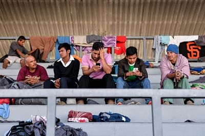 MEXICO CITY, Nov. 6, 2018 (Xinhua) -- Migrants rest in a temporary transit center for migrants from Central America in Mexico City, capital of Mexico, Nov. 5, 2018. A large number of migrants from Central America gathered in Mexico City to prepare for moving towards the United States. (Xinhua/Xin Yuewei/IANS)