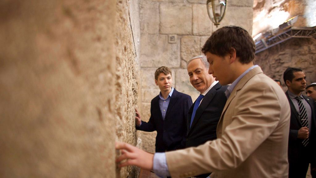 Israeli Prime Minister Benjamin Netanyahu (centre) prays with his sons Yair Netanyahu (left) and Avner Netanyahu at the Western Wall, the holiest site where Jews can pray in Jerusalem’s old city.&nbsp;