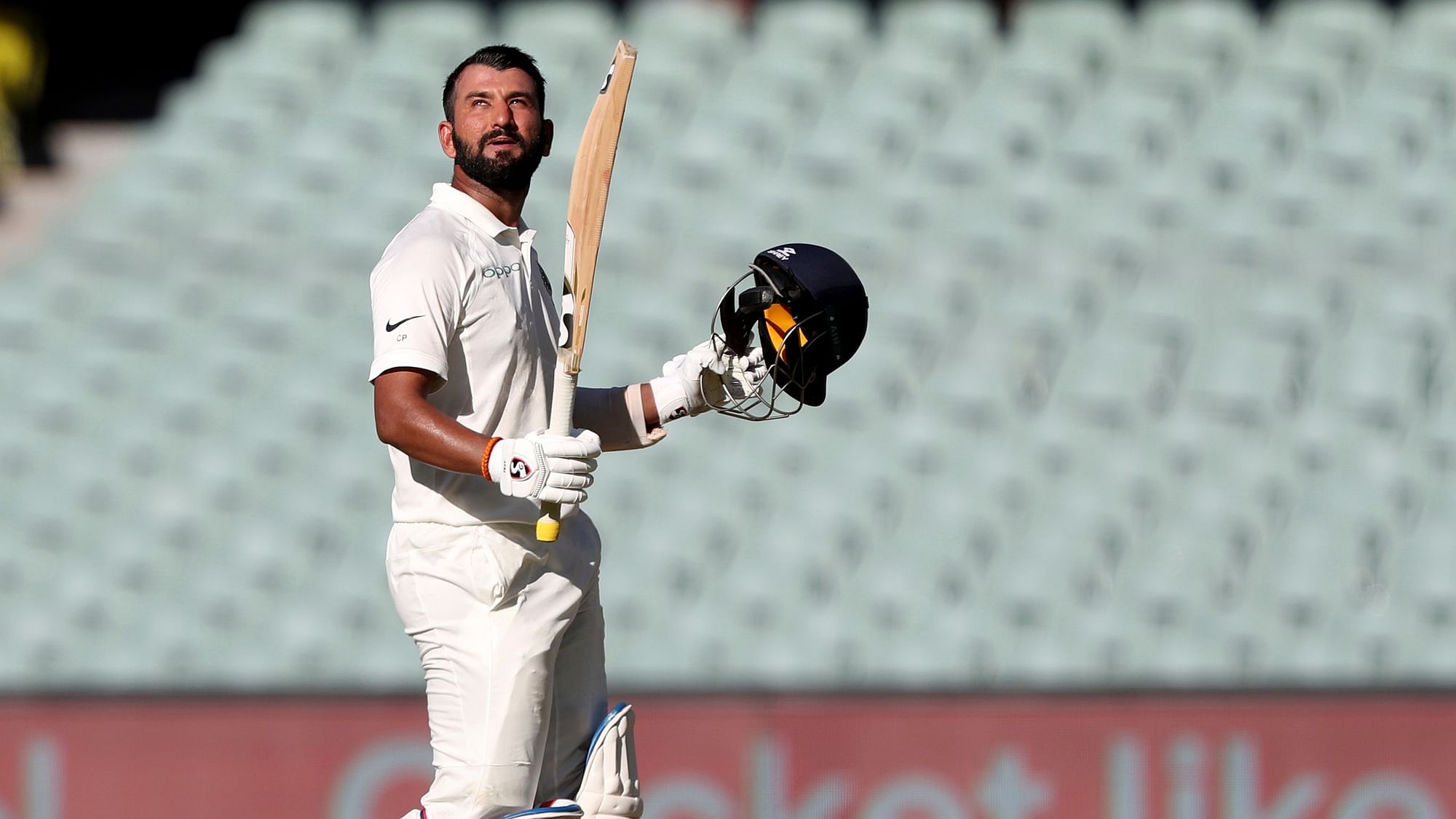 Cheteshwar Pujara’s 123 guided India to 250 for nine on the opening day of their first Test against Australia.