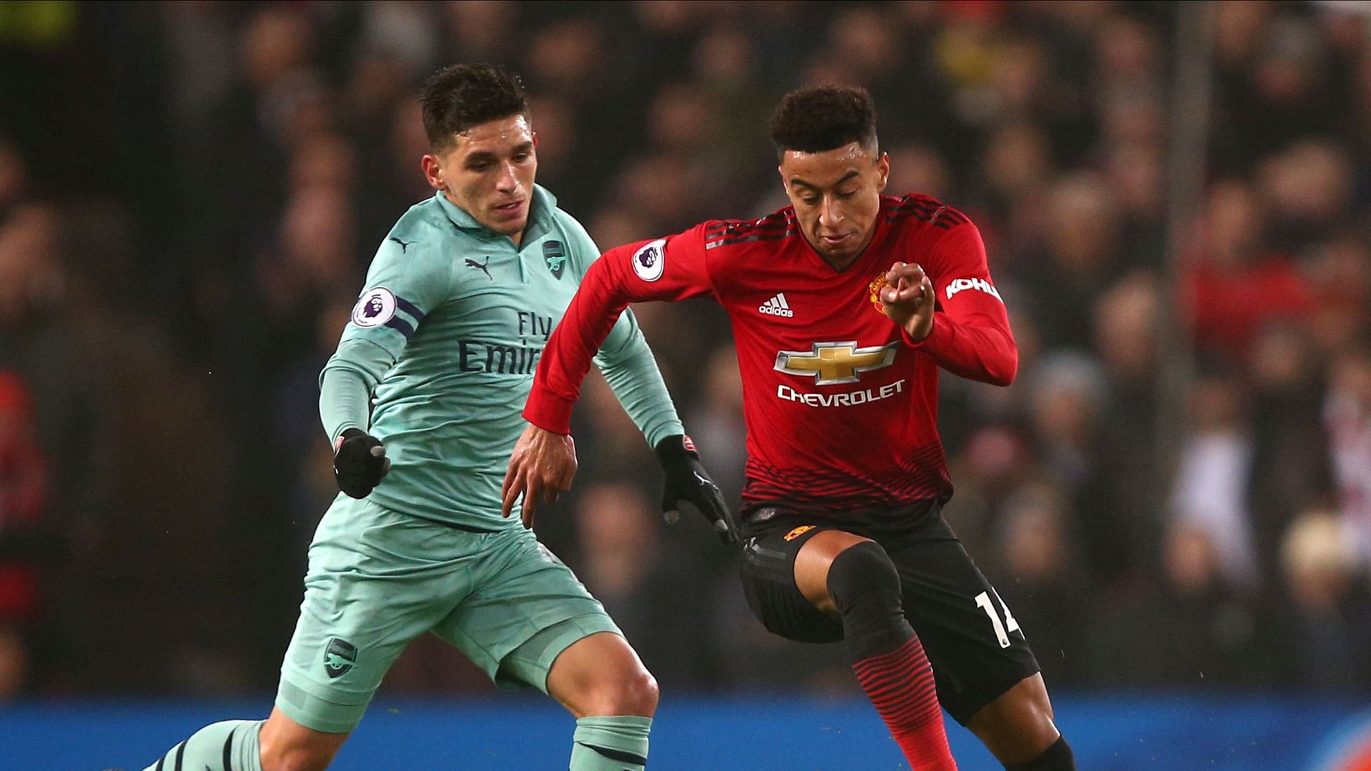 ManU midfielder Jesse Lingard, right, and Arsenal’s Lucas Torreira, left, vie for the ball during the English Premier League soccer match between Manchester United and Arsenal.