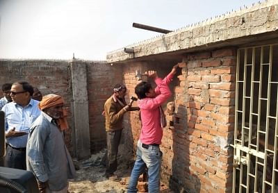 Muzaffarpur: Municipal Corporation workers demolish an illegal structure at a shelter home in Muzaffarpur, Bihar on Dec 13, 2018. (Photo: IANS)