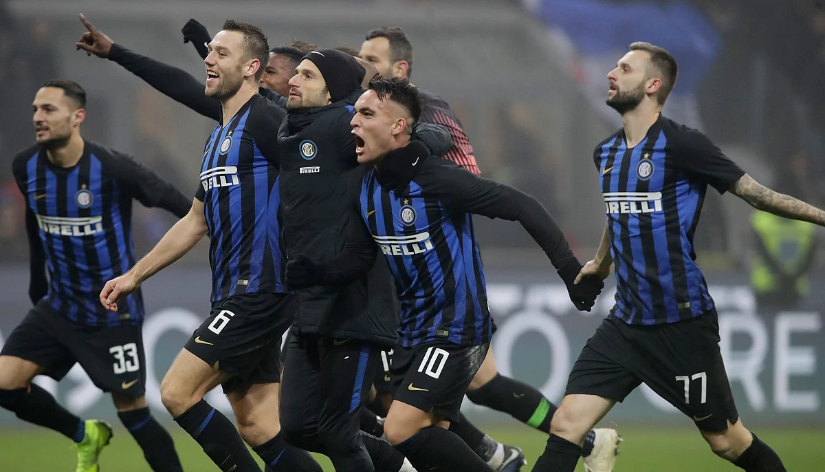 Inter Milan’s Lautaro Martinez celebrates with his teammates at the end of a Serie A soccer match between Inter Milan and Napoli, at the San Siro stadium in Milan, Italy, Wednesday, Dec.26, 2018.