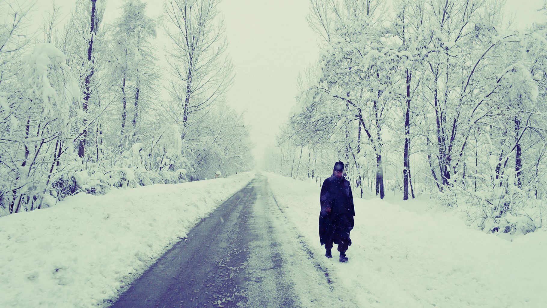 A Kashmiri man walks through a snow-covered road in Anantanag. Archival image used for representational purposes.