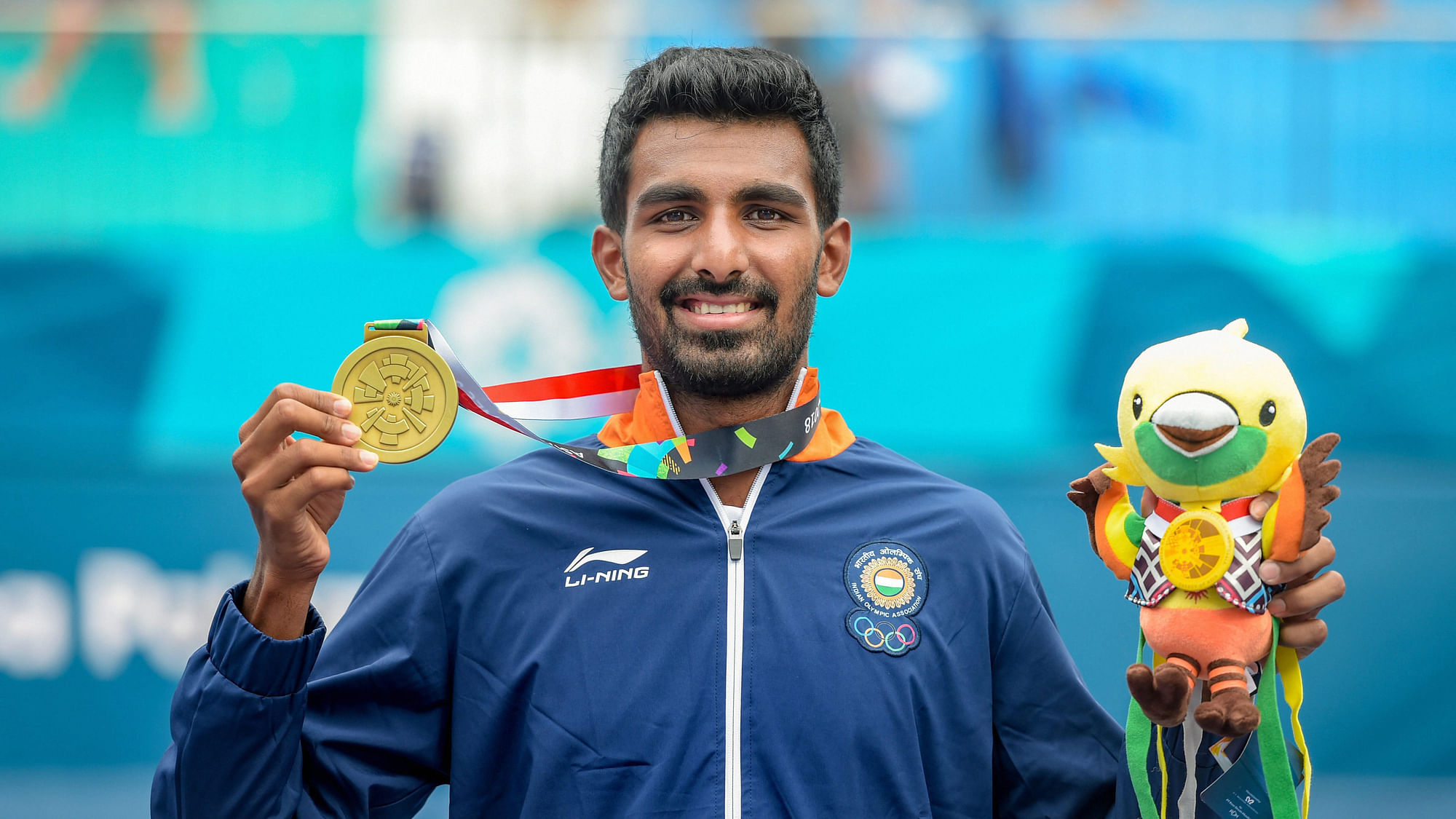Prajnesh Gunneswaran poses with his bronze medal during the medal ceremony for the men’s singles tennis event at the 18th Asian Games 2018.