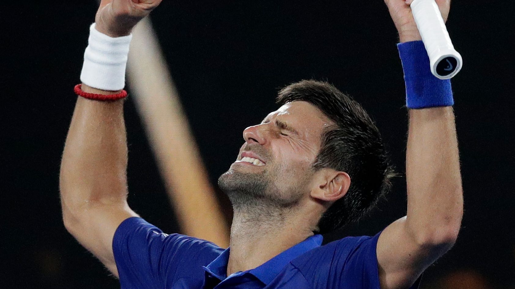 Novak Djokovic celebrates after getting past 15th seed Daniil Medvedev in four sets in the fourth round of the Australian Open.