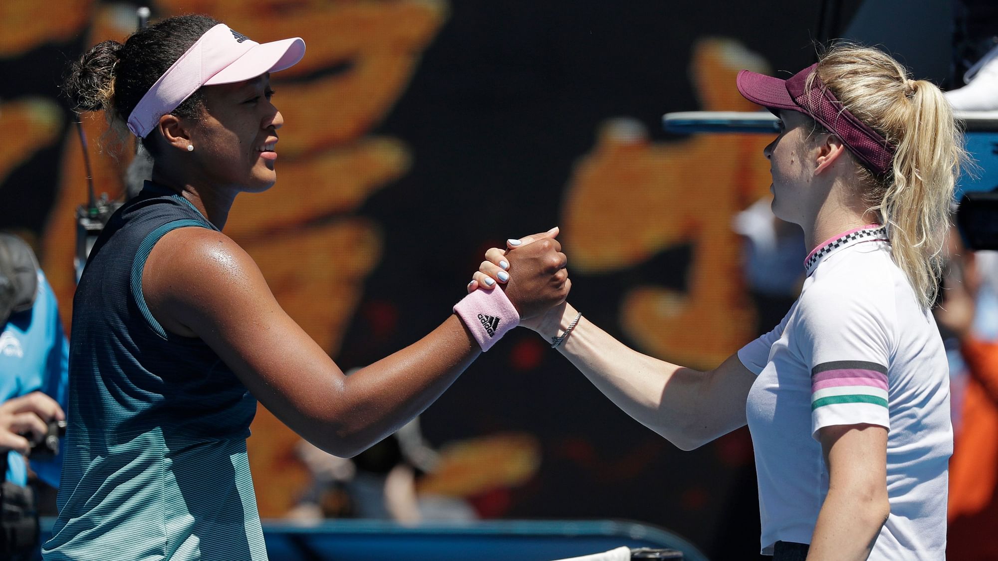 Naomi Osaka and Elina Svitolina meet at the net after the Japanese fourth seed won their quarter-final clash at the Australian Open.