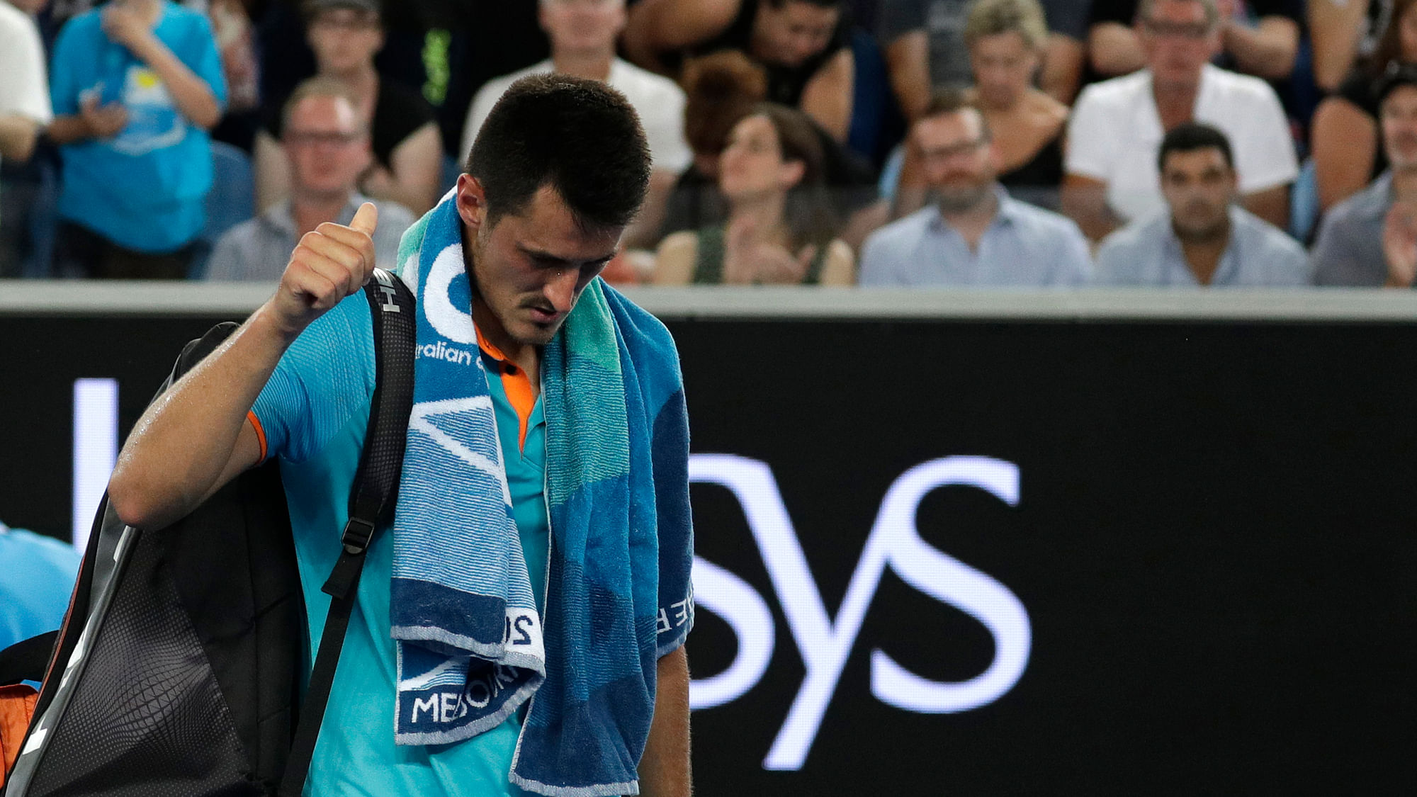 Australia’s Bernard Tomic gestures as he leaves the court following his first round loss to Croatia’s Marin Cilic at the Australian Open tennis championships in Melbourne, Australia, Monday, Jan. 14, 2019.