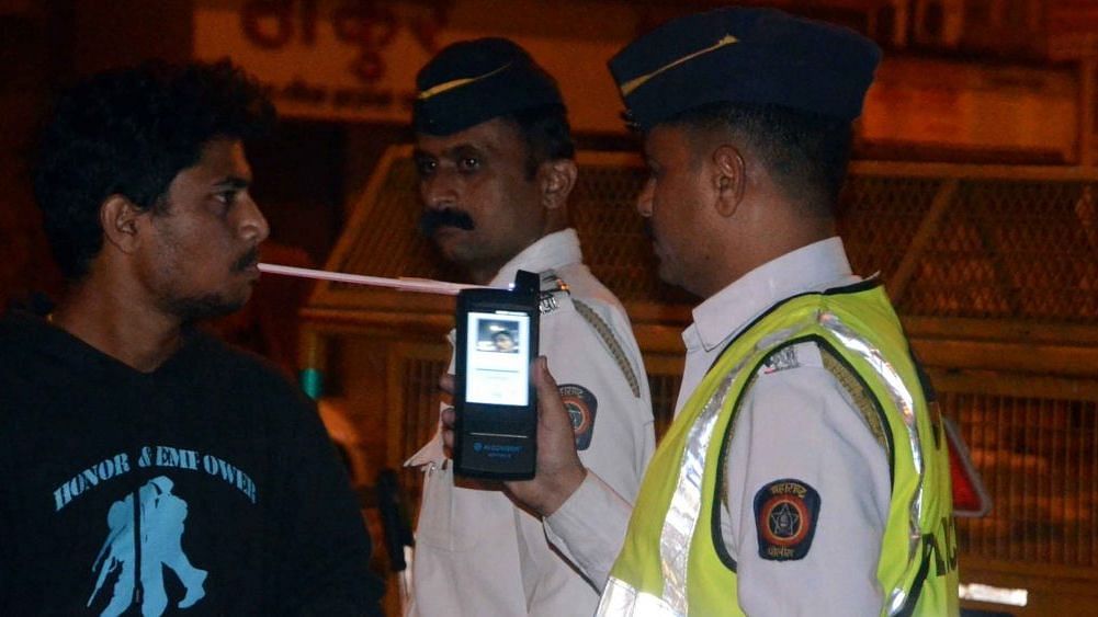  Traffic police carry out breathalyser test to check for driving under the influence of alcohol.