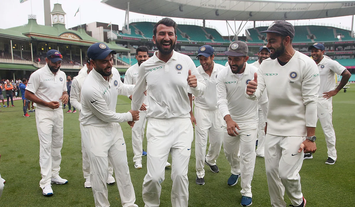 Cheteshwar Pujara enjoys a light moment with his teammates during a victory dance after the series win in Sydney.
