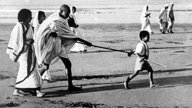 Kanu Gandhi was the little child holding Mahatma’s stick in this iconic Dandi march photo