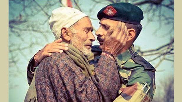 A serving Indian Army officer consoling  father of Lance Naik Nazir Ahmad of 34 Rashtriya Rifles, who lost his life fighting terrorists in Shopian in Kulgam district of J&amp;K.