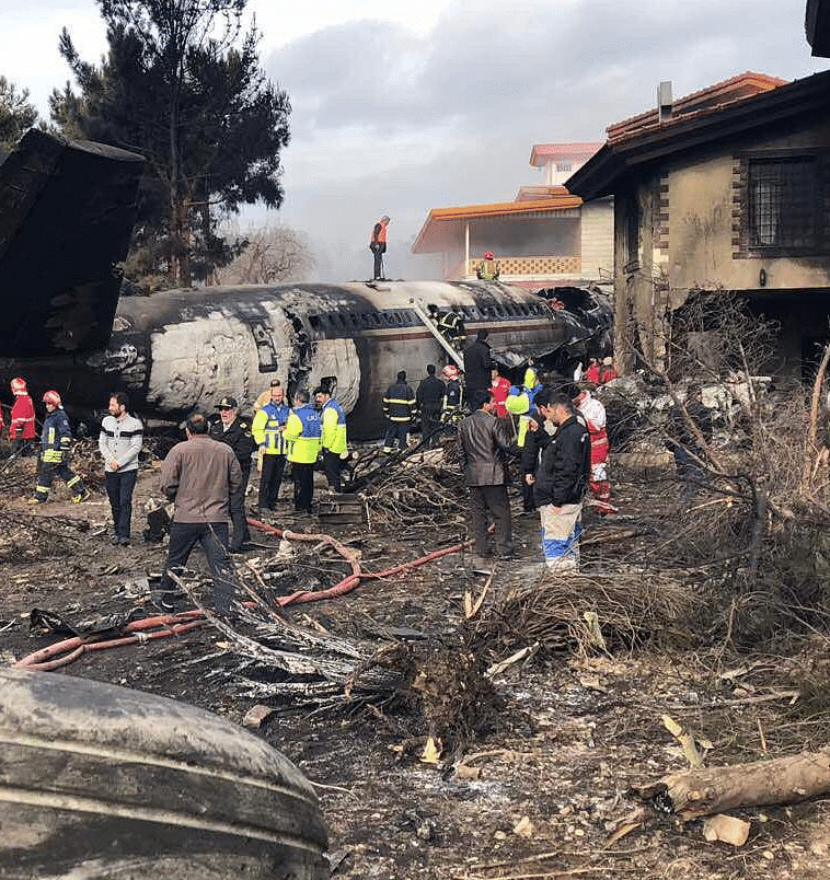 Images carried by  media showed the burned-out tail of the plane sticking out, surrounded by charred homes.