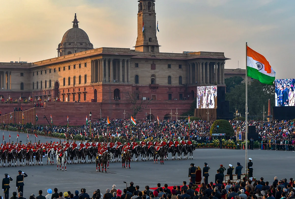 The national flag is unfurled as President Ram Nath Kovind and tri-services chiefs salute during the Beating Retreat ceremony at Vijay Chowk in New Delhi.