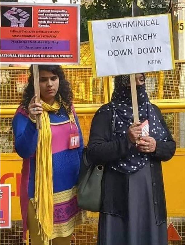 The photo of two women holding placards went viral, with many immediately taking to photoshop different claims.