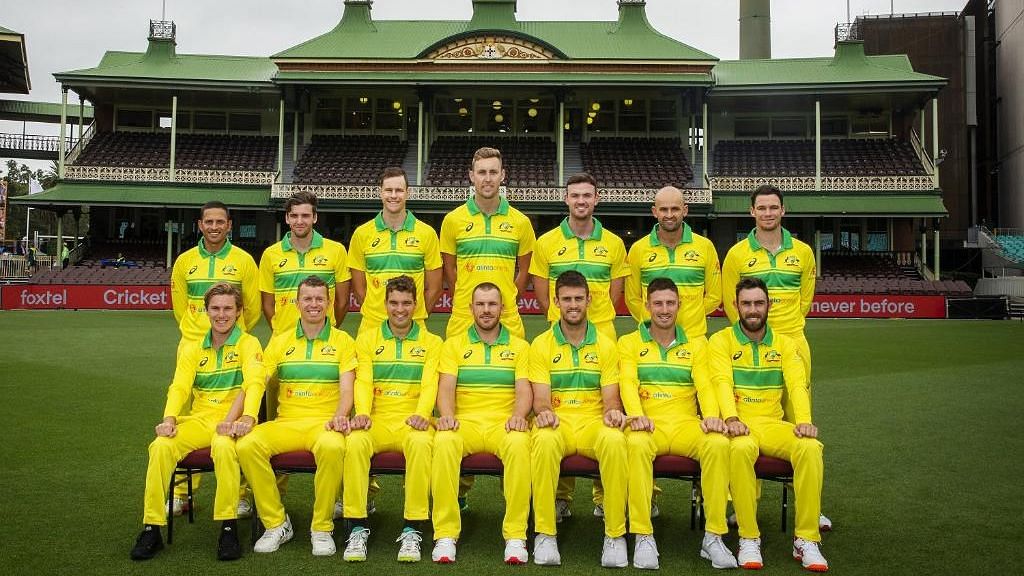 The Australian squad pose in their new jersey, inspired by a strip from the 1980s, ahead of their ODI series against India.