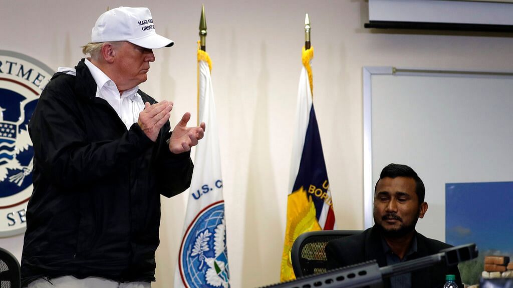 US President Donald Trump recognises Reggie Singh, brother of slain California police officer Cpl Ronil Singh, at a roundtable on immigration and border security at  Border Patrol  Station in McAllen, Texas.