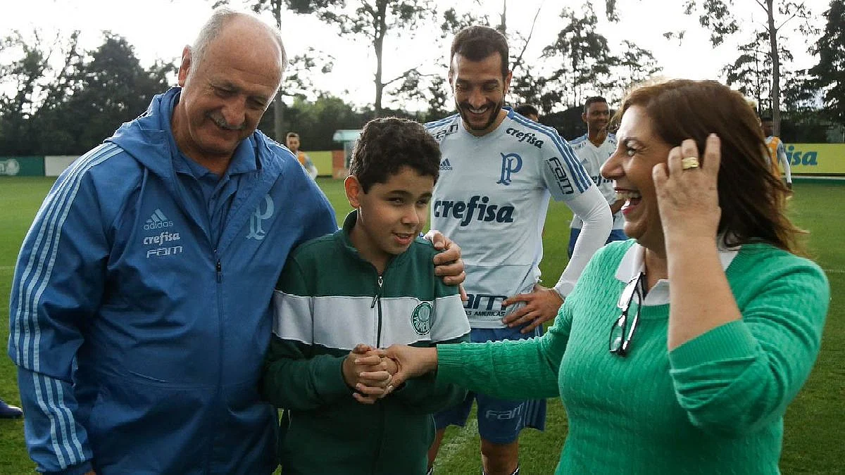 Silvia and Nickollas with Palmeiras coach Luiz Felipe Scolari.