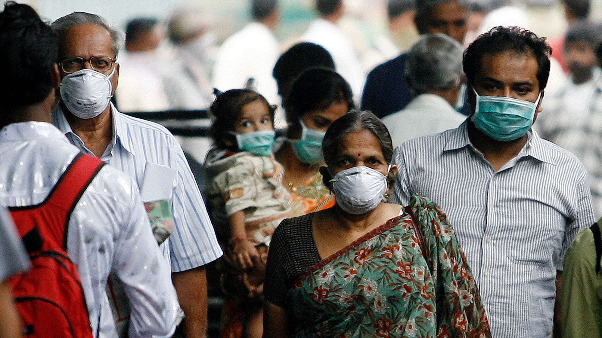 Representational image of people wearing masks to protect themselves against swine flu.